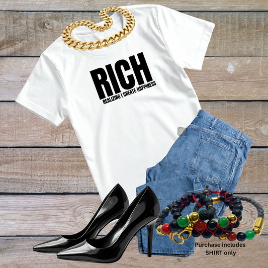 White t-shirt with 'RICH' text, black high heels, denim shorts, and colorful bracelets on a wooden surface.