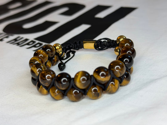Bracelet with tiger eye beads on a white background