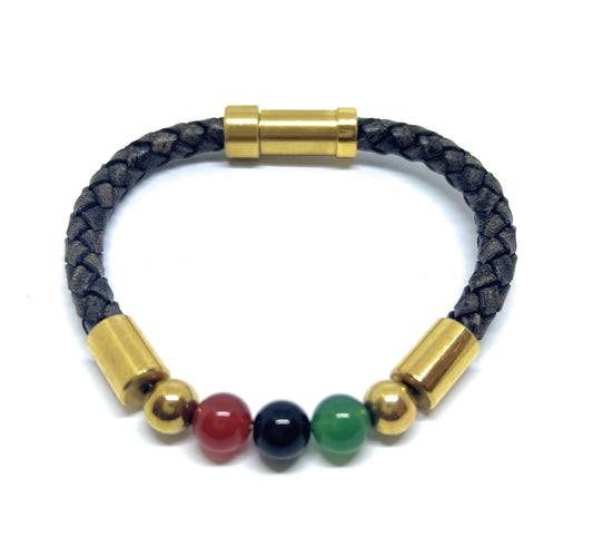 Bracelet with gold cylindrical clasps and colorful beads on a white background