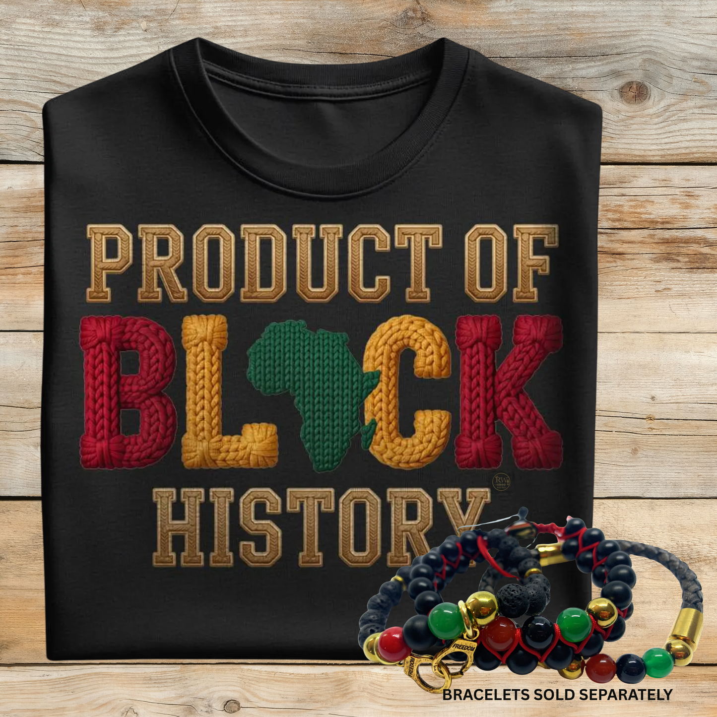 Black t-shirt with 'Product of Black History' text and braided bracelets on a wooden surface