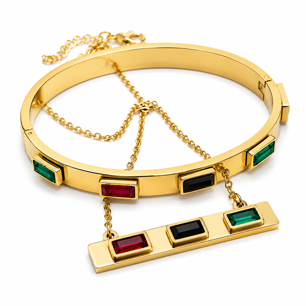 Gold-tone bangle bracelet with rectangular green and red gemstone accents and a matching bar pendant on a white background.