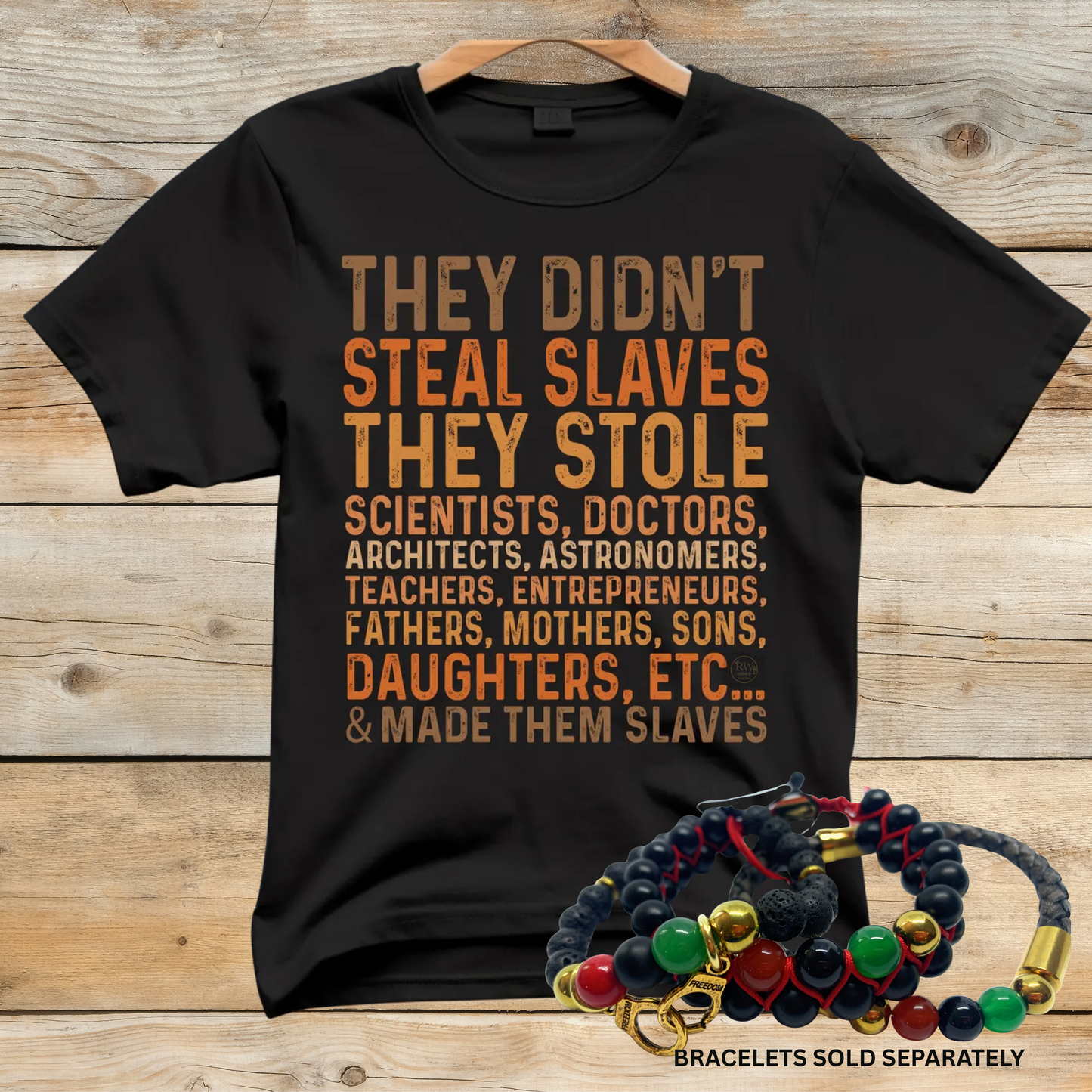 Black t-shirt with text on a wooden background, accompanied by colorful bracelets.
